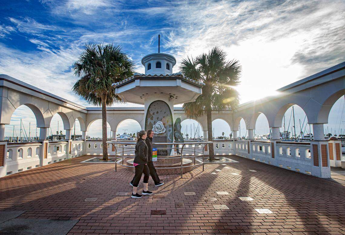 Morning walkers stroll by the memorial of Selena Quintanilla-Perez, the “Queen of Tejano Music”, along the seawall in Corpus Christi, Texas, Wednesday, Nov. 22, 2023. Mirador de la Flor, or Overlook of the Flower, was unveiled in 1997 to honor Quintanilla-Perez and her contributions to music and Corpus Christi. The life-size bronze statue of Selena was sculpted by H.W. “Buddy” Tatum, a Corpus Christi artist. The musician was 24 years old when she died in 1995.