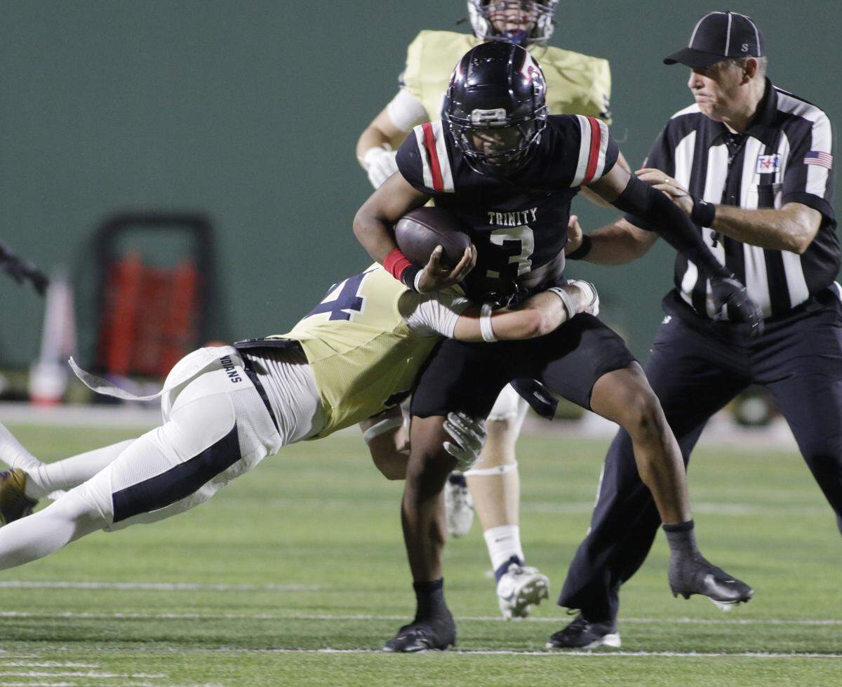 Euless Trinity’s Zo Palmore (3) is brought down by the Keller defense during their game on Friday, October 17, 2025 at Pennington Field in Bedford, Texas.