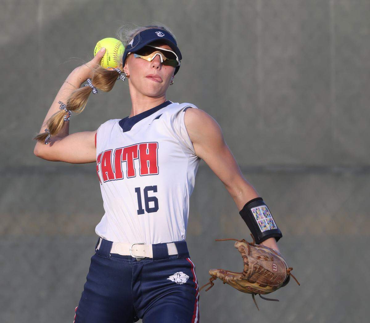 Grapevine Faith center fielder tosses one in from the left field during a softball game at Oak Grove Park in Grapevine, Tx. Tuesday, March 31, 2026