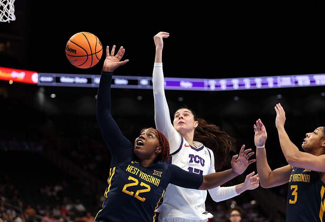 KANSAS CITY, MISSOURI - MARCH 08: Kierra Wheeler #22 of the West Virginia Mountaineers and Clara Silva #17 of the TCU Horned Frogs compete for a rebound during the championship game of the 2026 Big 12 Women's Tournament at T-Mobile Center on March 08, 2026 in Kansas City, Missouri. (Photo by Jamie Squire/Getty Images)