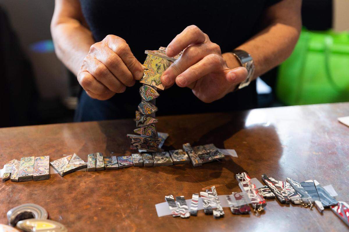 Cary O’Keefe works on jewelry at her shop in Sundance Square in downtown Fort Worth.