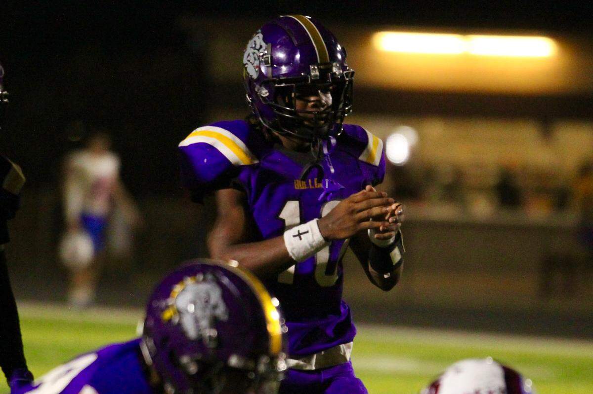 Everman quarterback Dawon Smith gets ready to take a snap against Grapevine in a District 3-5A D2 game on Friday, September 12, 2025 at Marr Stadium in Everman, Texas.