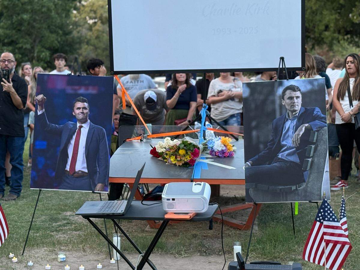 About 1,000 North Texans gathered at a prayer vigil to mourn conservative activist Charlie Kirk on Sunday night, Sept. 14, at Trinity Park in Fort Worth.