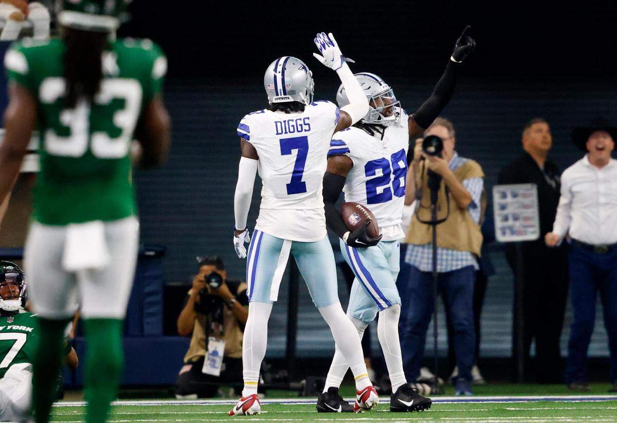 Dallas Cowboys safety Malik Hooker (28) celebrates with Trevon Diggs after intercepting the ball against the New York Jets on Sunday, September 17, 2023, at AT&T Stadium in Arlington.