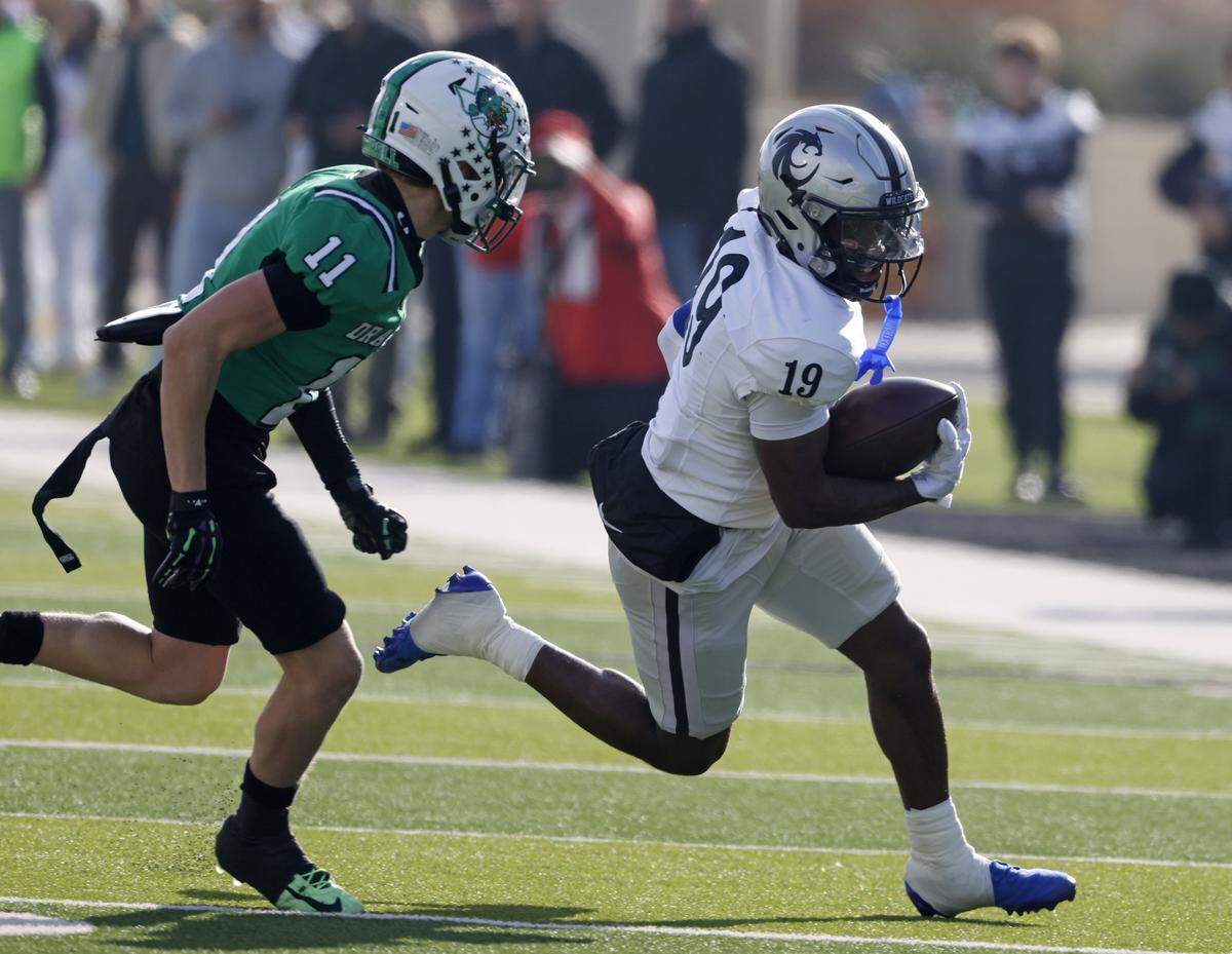 Southlake Carroll defensive back Taevin Kunz (11) chases Denton Guyer wide receiver Corbin Glasco (19) to the corner during the first half of a UIL Class 6A Division II Quarterfinal on Saturday Dec. 06, 2025 at Crowley ISD Multi-Purpose Stadium in Fort Worth, Texas.