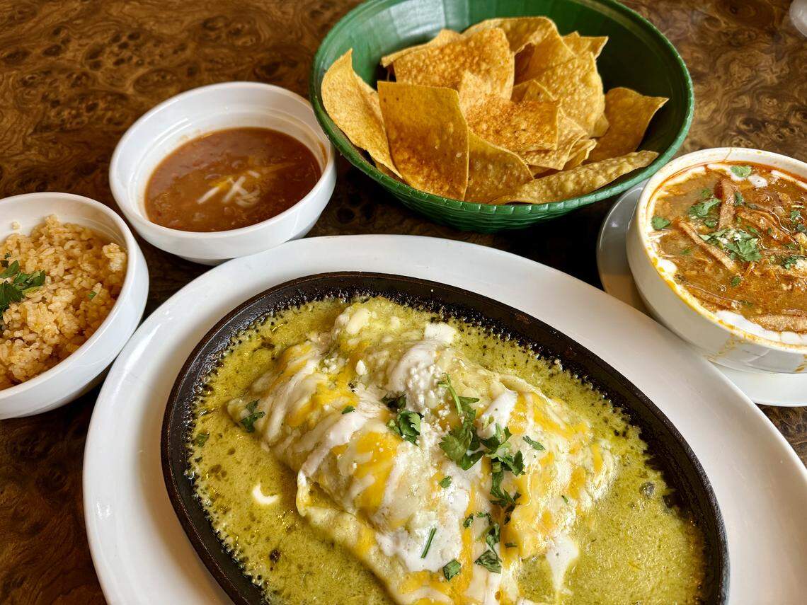 A chicken enchilada dinner at Campo Verde Mexican Bar & Grill with chicken tortilla soup, right, as seen Nov. 20, 2025.