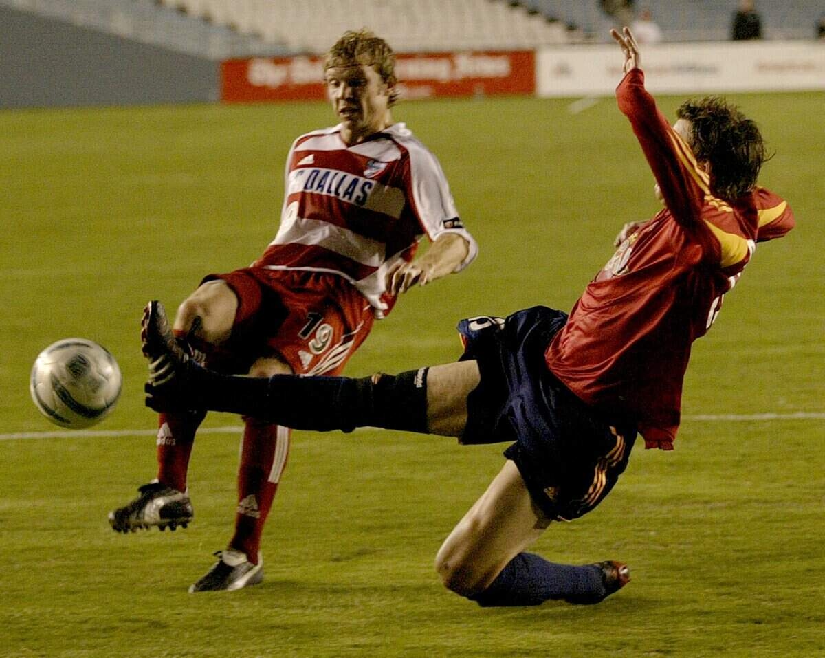 Bobby Rhine, of FC Dallas, battles with Brian Dunseth, of Real Salt Lake in the second half of the FC Dallas vs. Real Salt Lake MLS game at the Cottton Bowl in Dallas on April 23, 2005. (Star-Telegram/Alison Woodworth) Pro soccer