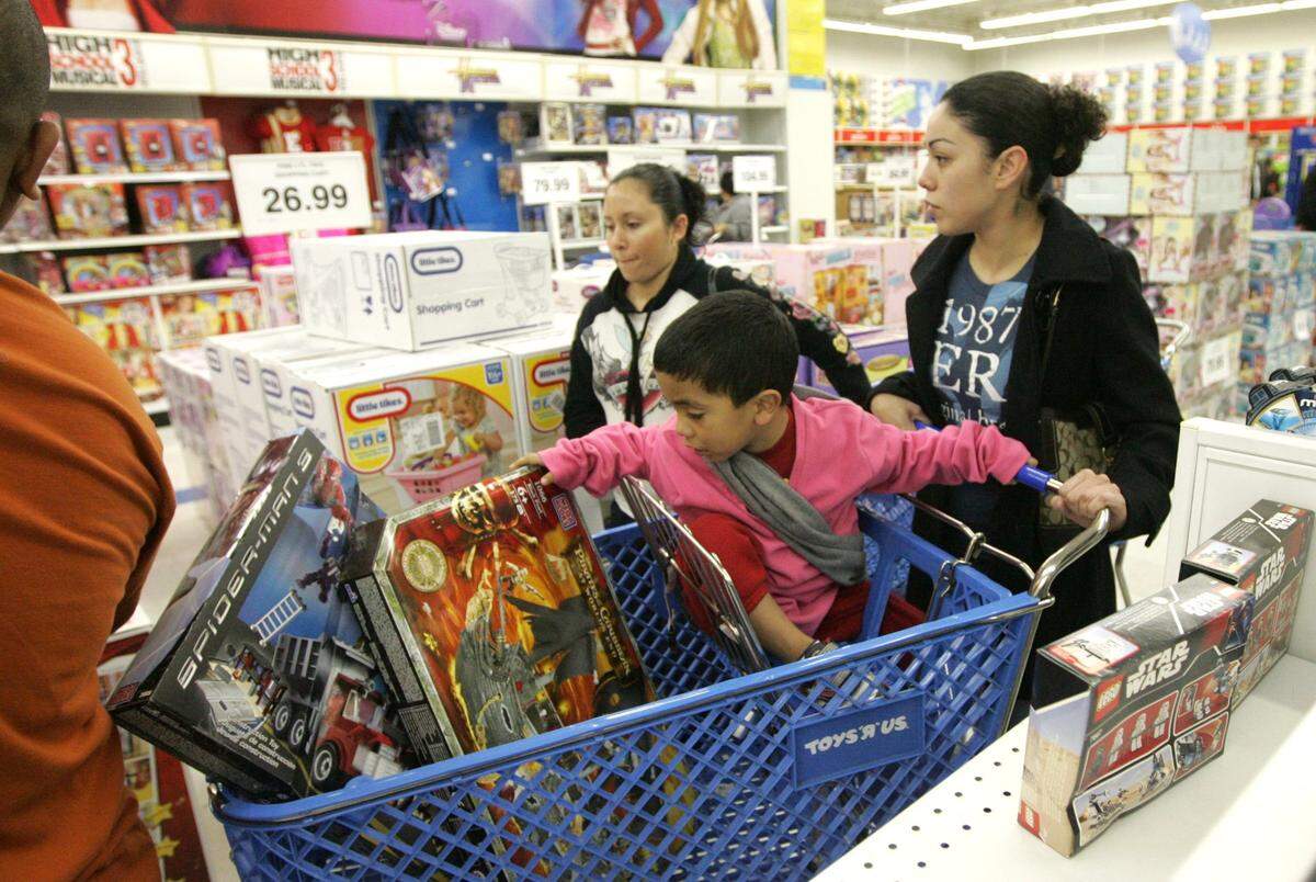 Nov. 28, 2008: Monica Hernandez of Arlington shops at the Toys R Us in Arlington at 5 a.m. on Black Friday with her 3-year-old son, Kruz.