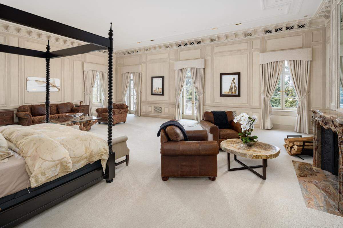 Primary Suite in the Crespi Estate is has three walls of windows and botanical views.