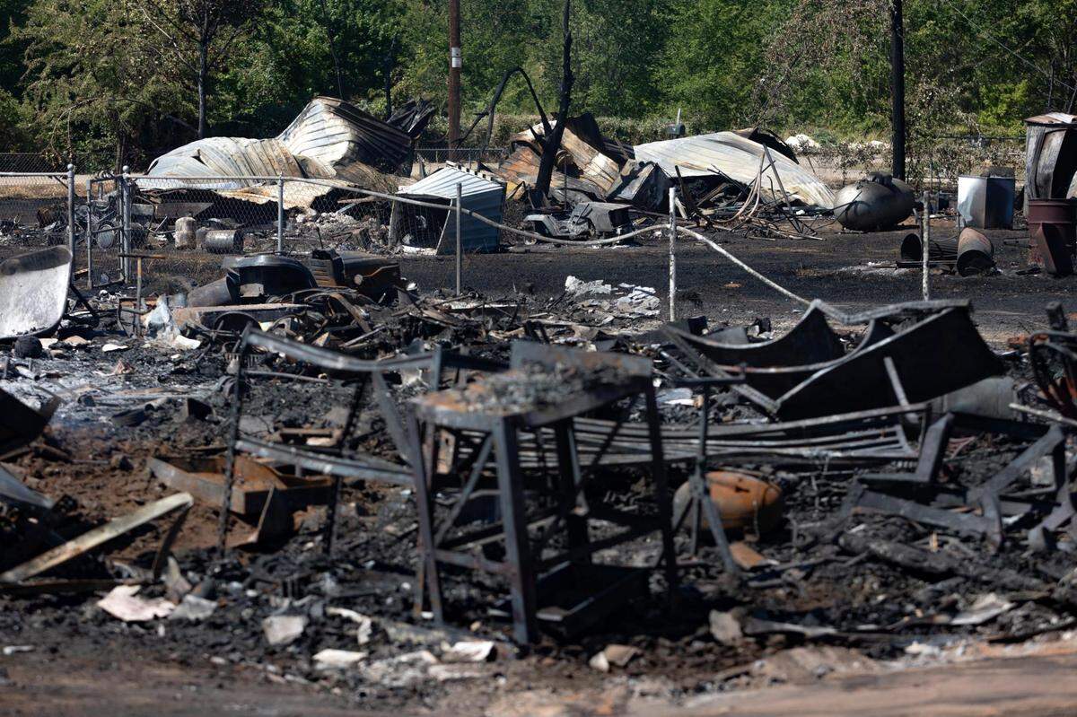 Two burned-down structures in a neighborhood in Rendon, Texas, on Wednesday, July 27, 2022.