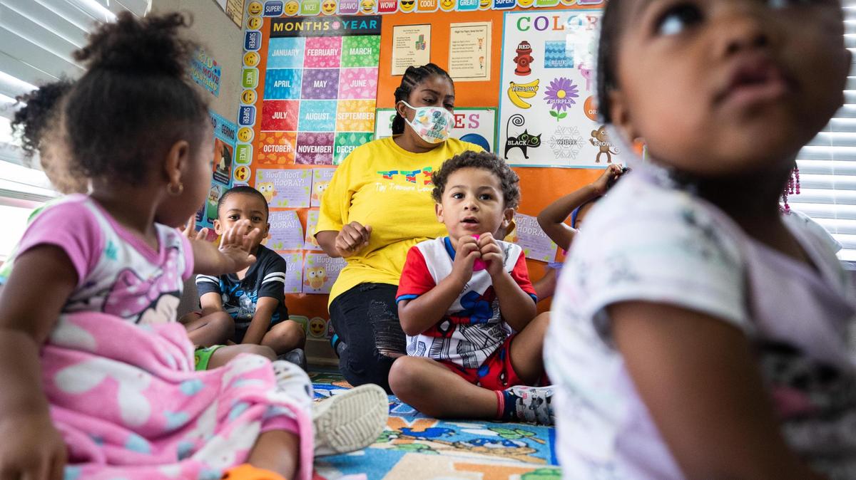 Children greet each other during class at Tiny Treasures Academy in Fort Worth in July. In the first year of the pandemic, less than half of children ages 3 and 4 enrolled in pre-K in the United States.