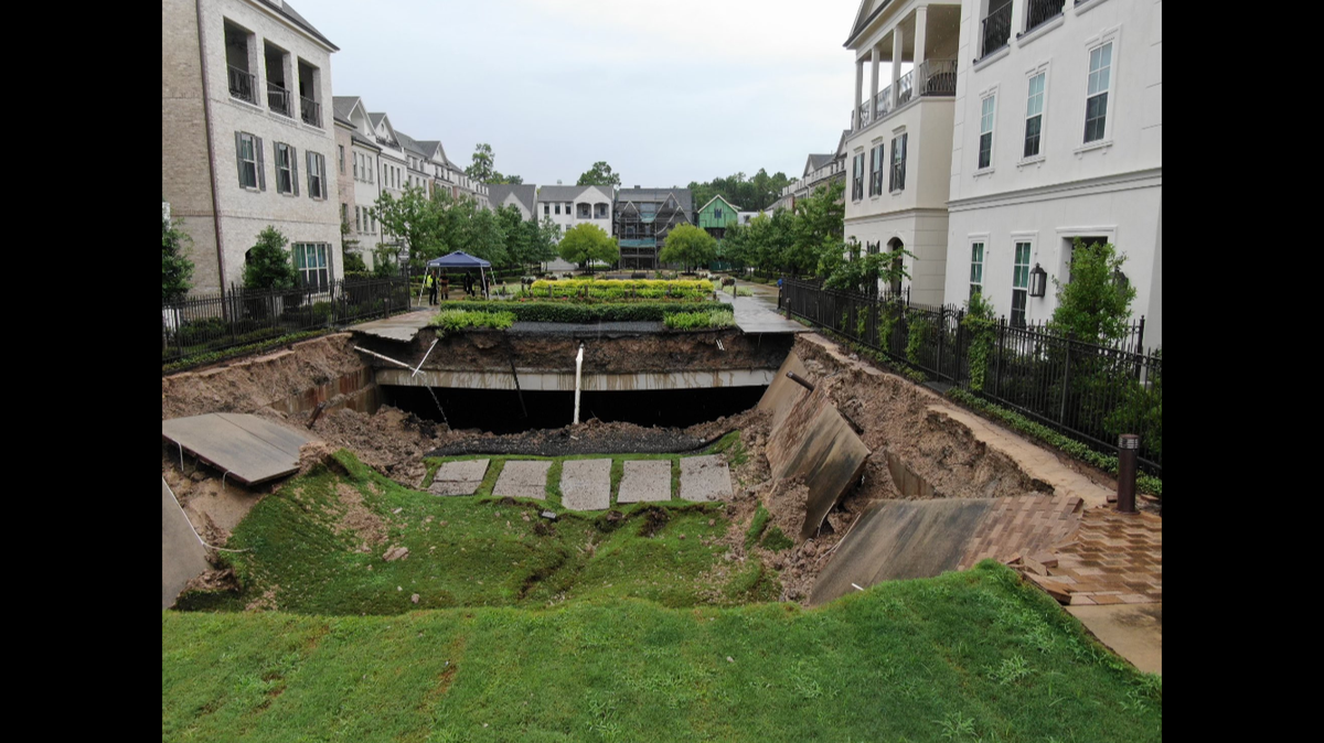Homes were evacuated at a condo community in Houston after the ground suddenly collapsed, Texas officials say.