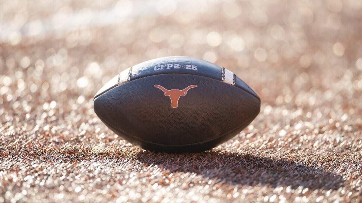 Dec 21, 2024; Austin, Texas, USA; Detailed view of a Texas Longhorns logo on an official NCAA football on the field during the CFP National playoff first round at Darrell K Royal-Texas Memorial Stadium. Mandatory Credit: Mark J. Rebilas-Imagn Images