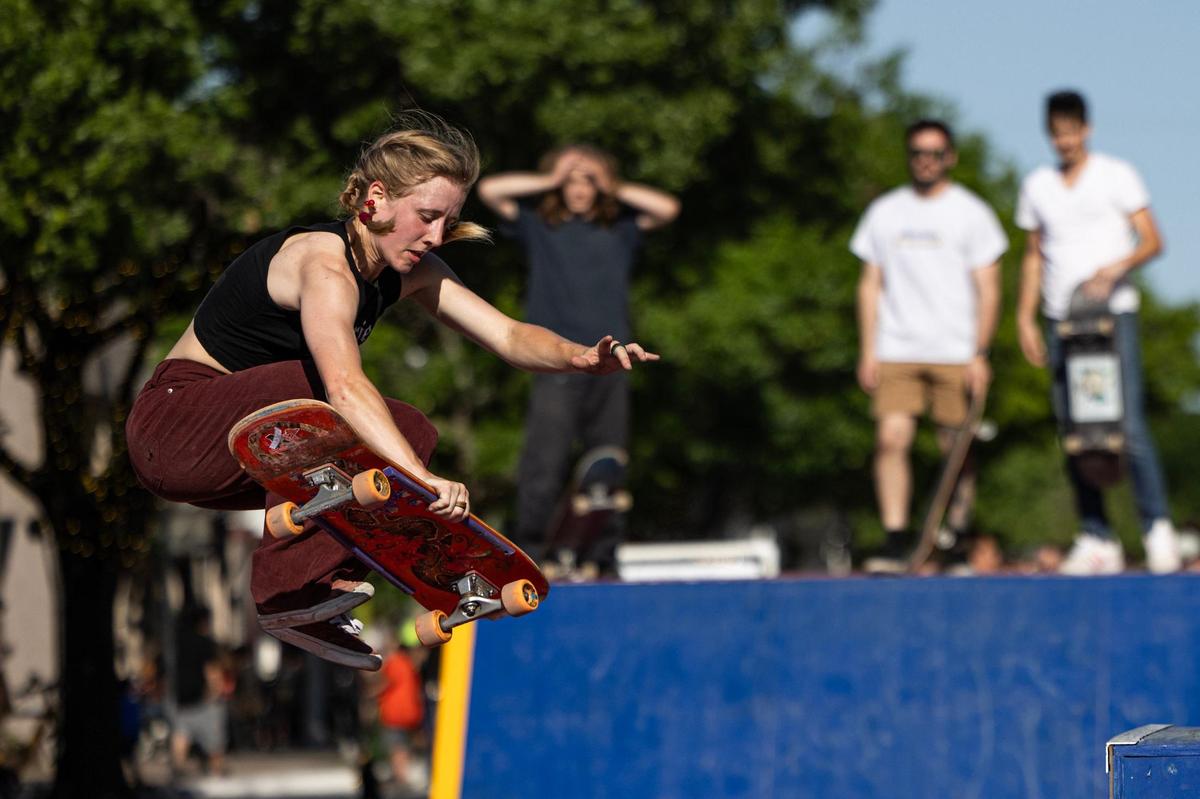 Savannah Linger performs a skate trick on a ramp in the skate jam area of Open Streets on Magnolia Avenue in Fort Worth on Saturday, April 13, 2024. Open Streets is a national movement encouraging innovative ways to achieve environmental, social, economic, and public health goals by temporarily closing streets to automobile traffic, so that people may use them for walking, bicycling, dancing, playing, and socializing.