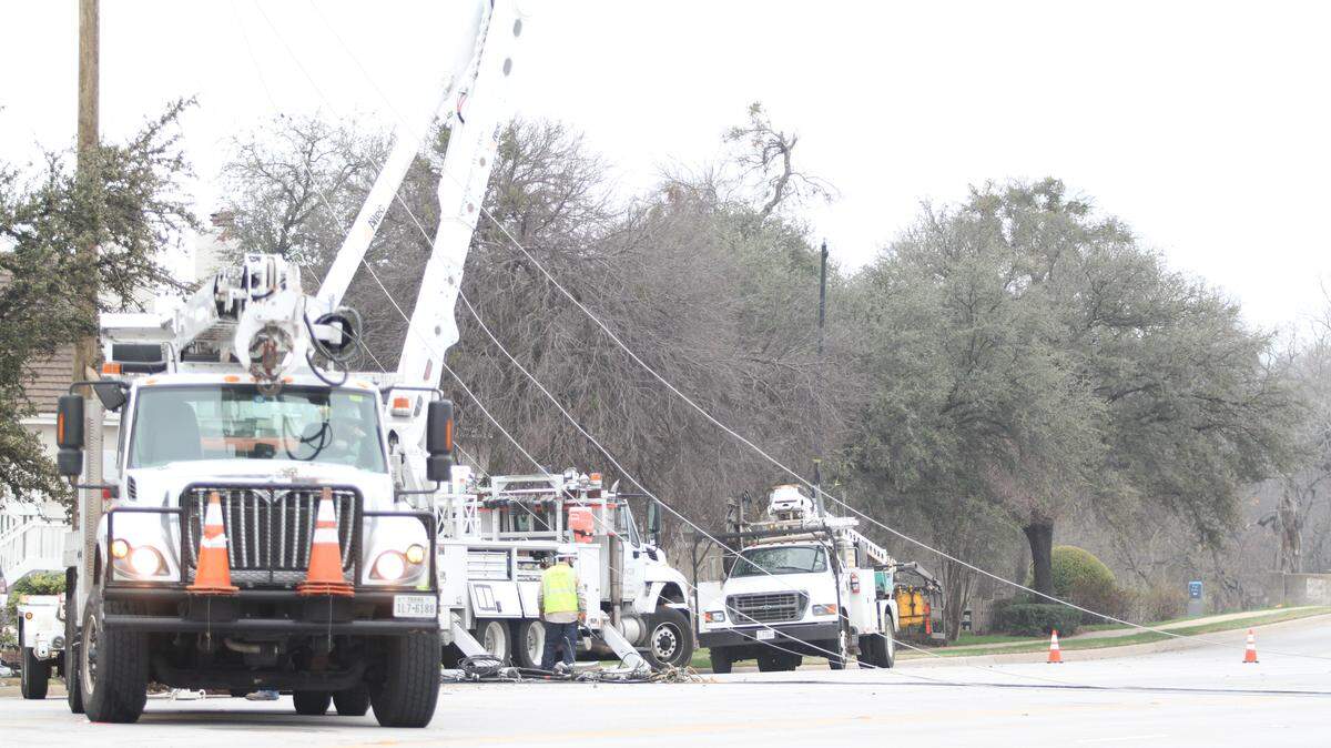 An Oncor crew works on downed power lines on the 1700 block of S. University Drive, Feb. 27, 2018.