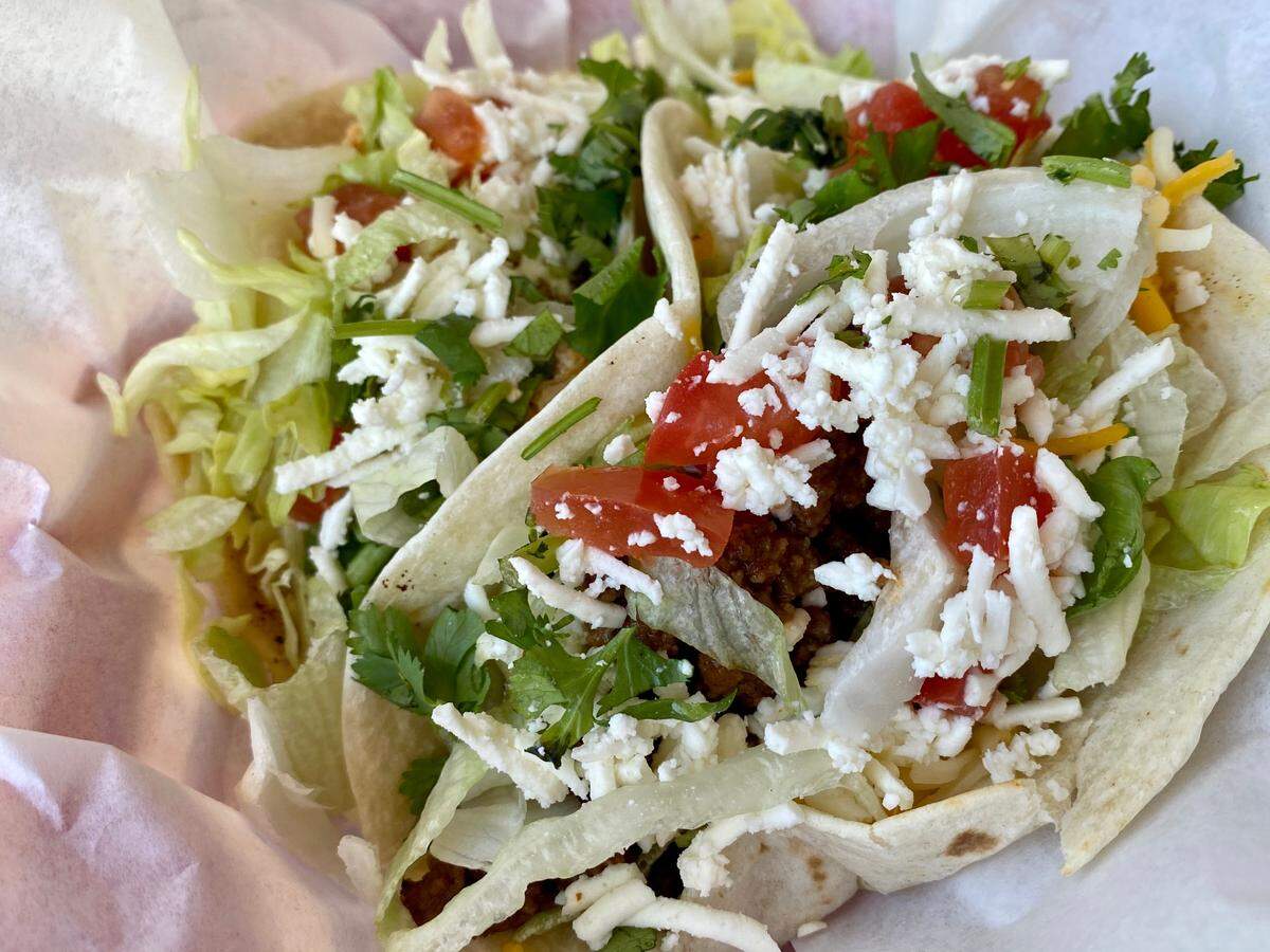 Ground beef (foreground), chicken or brisket tacos are $1..49 for National Taco Day at Fuzzy’s.