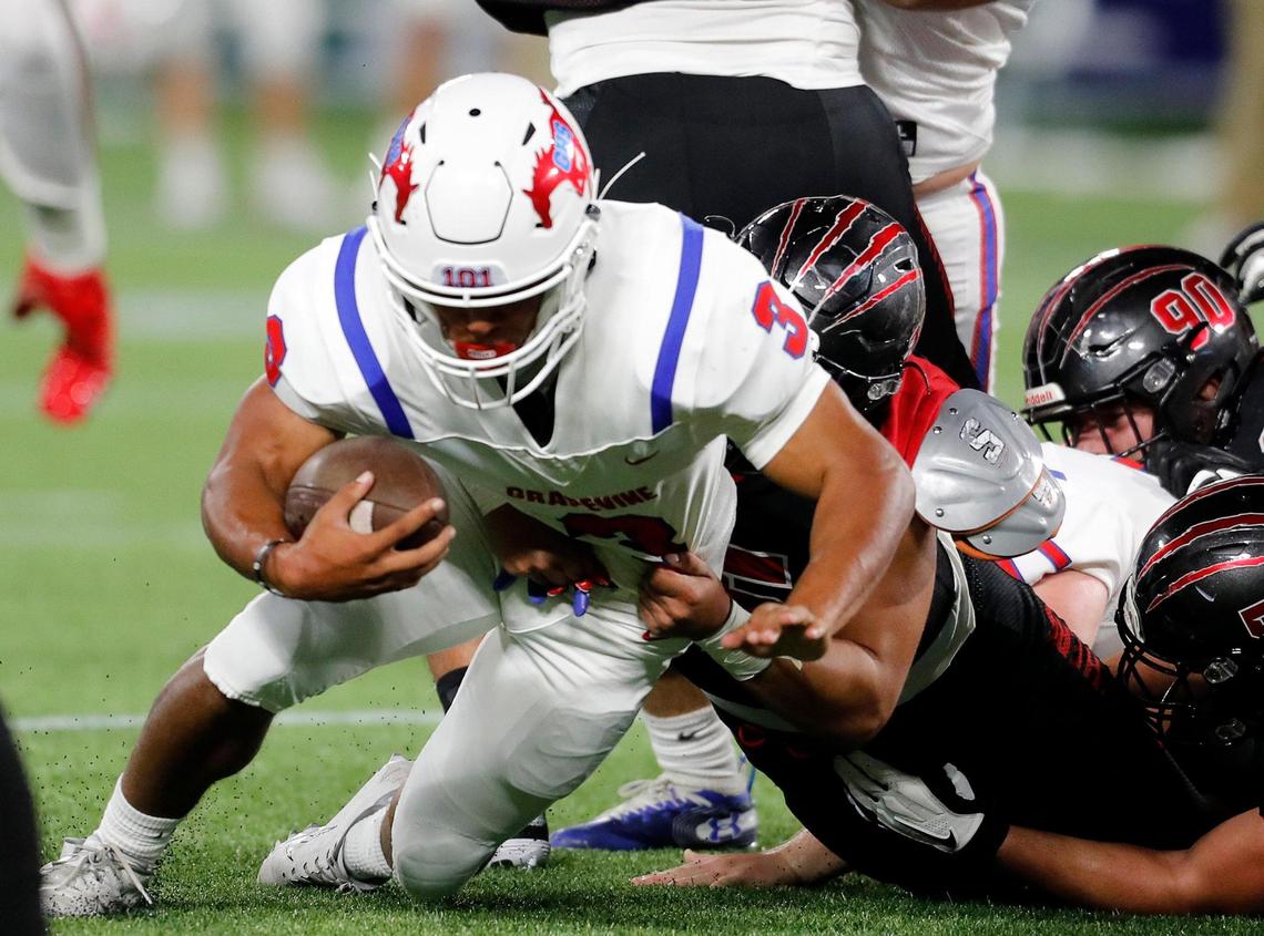 Grapevine running back Caleb Texada (3) is dropped behind the line during a high school football game at Globe Life Park in Arlington, Texas, Saturday, Sept. 26, 2020. Colleyville led 28-24 at the half. (Special to the Star-Telegram Bob Booth)