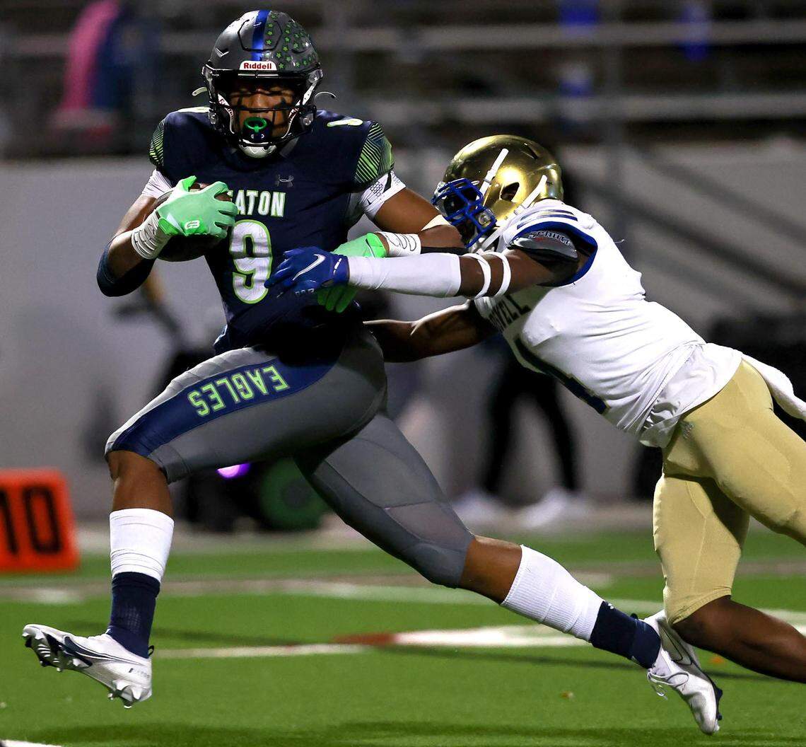 Eaton wide receiver Jaden Platt (9) fights off Fort Worth Boswell defensive back Henry Marvie (4) for a 40 yard touchdown reception during the first half of the 6A Bi-District Region I Division II High School Football playoff game played at Northwest ISD Stadium on Thursday, November 11, 2021, in Justin. (Steve Nurenberg/Special to the Star-Telegram)