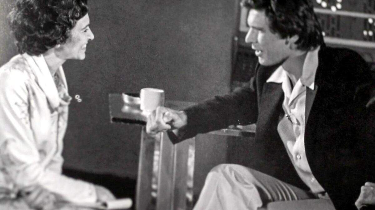 A photograph from Talking to the Stars: Bobbie Wygant’s Seventy Years in Television shows her talking with Harrison Ford early in his career. The book details her trailblazing career and the celebrities she’s interviewed.