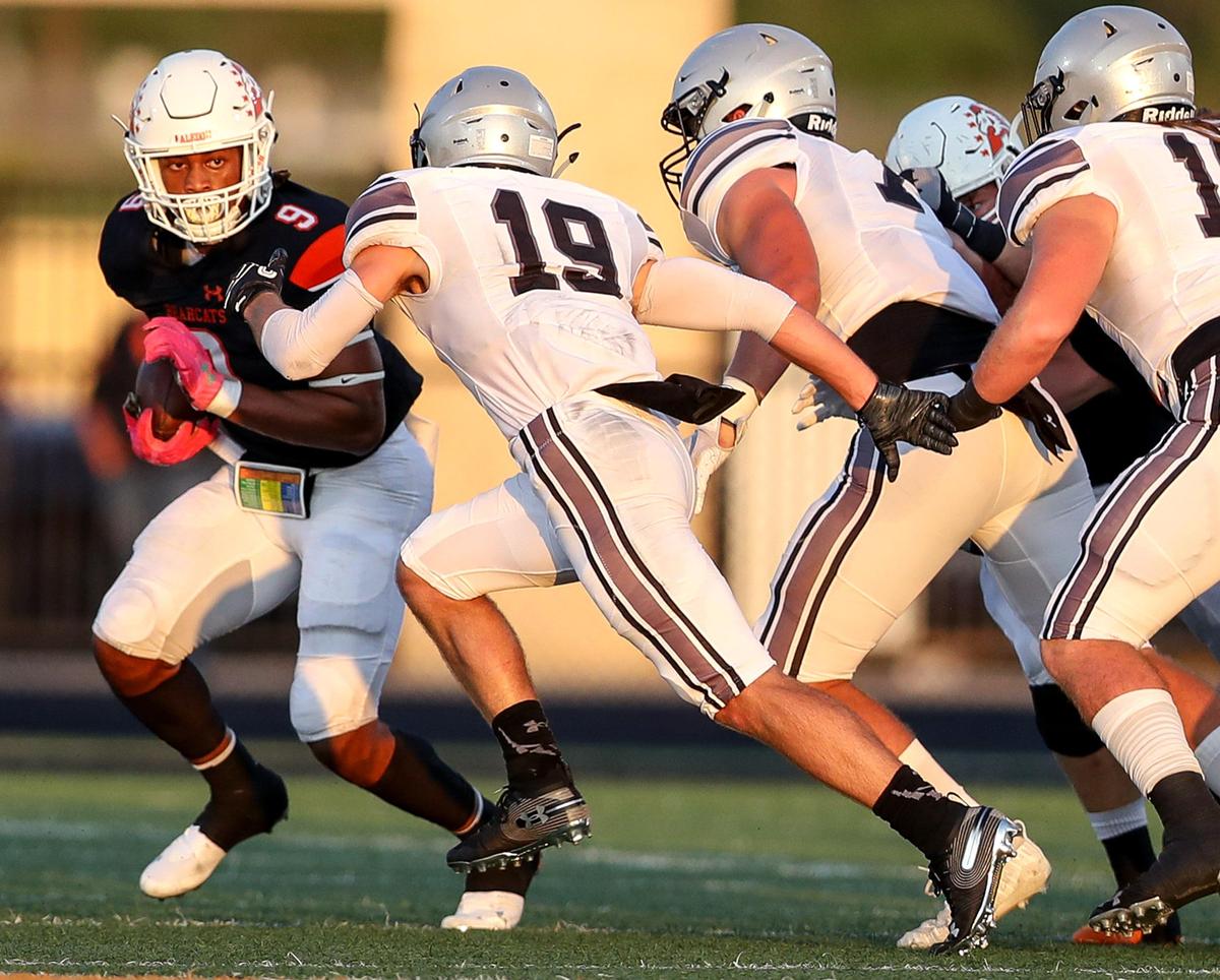 Aledo running back Jase McClellan (9) tries to get past Denton Guyer defensive back Seth Meador (19) and the rest of the Denton Guyer defense during the first half, Friday night, August 30, 2019 played at Bearcat Stadium in Aledo, TX.
