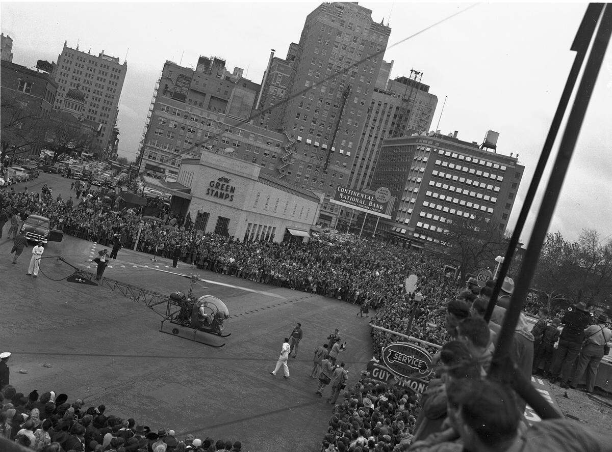 Santa Claus poses with parade viewers shortly after arriving in Fort Worth in a Bell helicopter. The crowd reportedly topped 125,000.