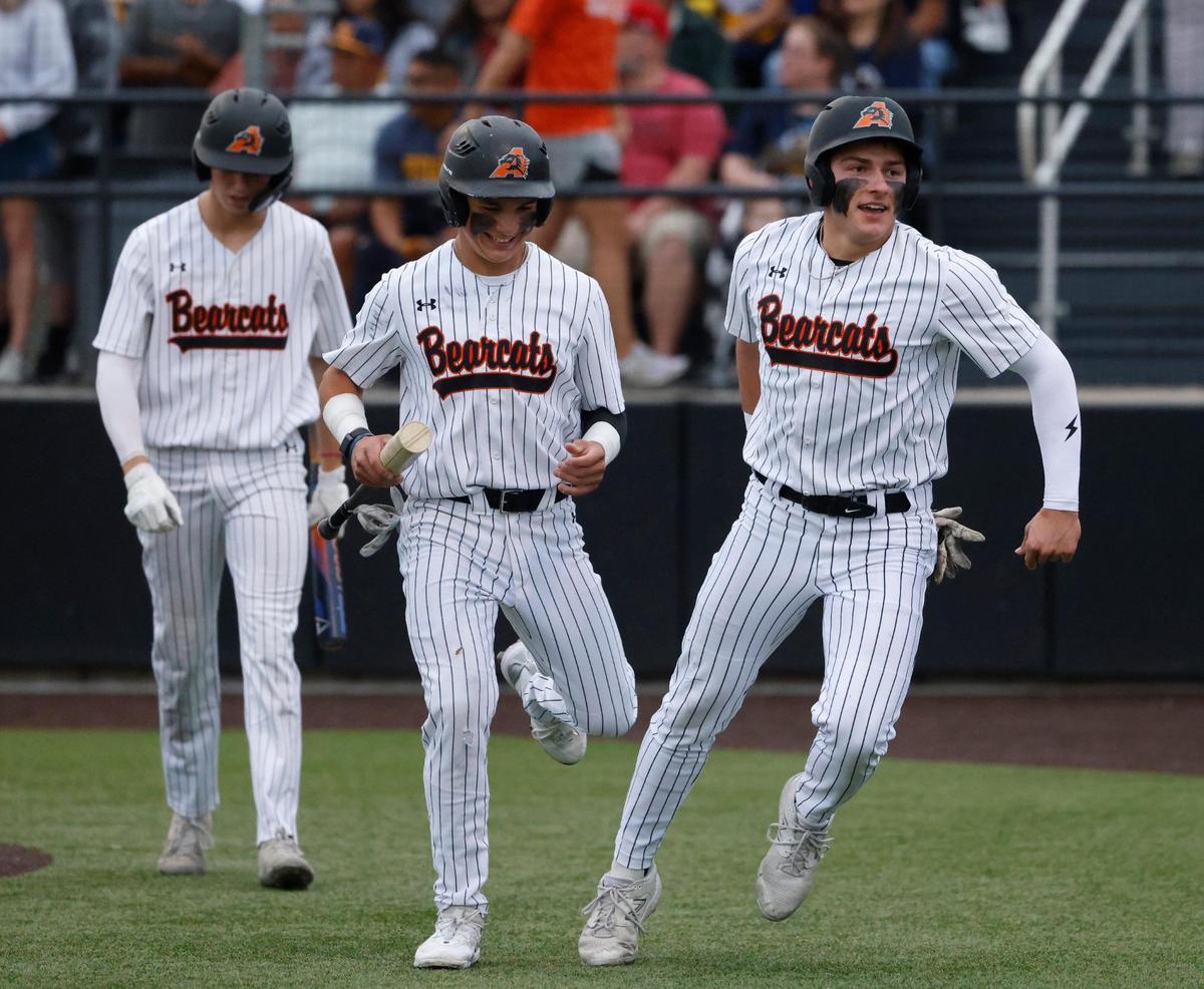 Aledo short stop Nick Foster (3) celebrates with designated hitter Lucas Nawrocki (16) and left fielder Luke Gladchuk (21) after they scored the first two runs of the game during a UIL Area Round 5AD1 baseball playoff game at Bearcat Field in Aledo, Texas, Thursday, May 08, 2025.