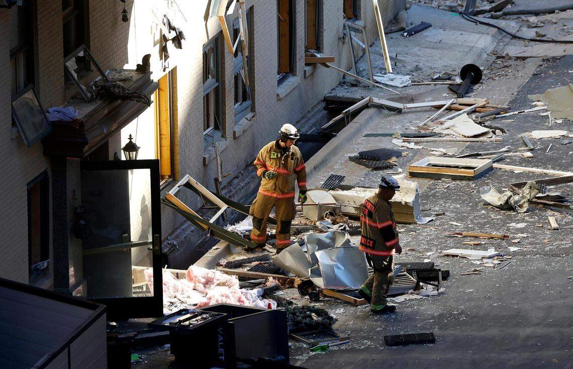 Members of the Fort Worth Fire Department inspect the rear of the Sandman Signature Hotel facing Throckmorton Street on Tuesday, January 9, 2024, in downtown Fort Worth. Multiple people were injured in the explosion Monday afternoon, with 21 hospitalized or treated on scene, according to the fire department and MedStar.