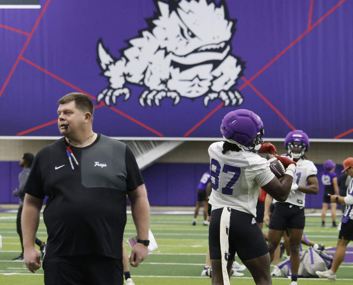 TCU offensive coordinator Gordon Sammis watches practice during the first day of Spring football practice at TCU in Fort Worth, Texas, Tuesday, March, 24, 2026.