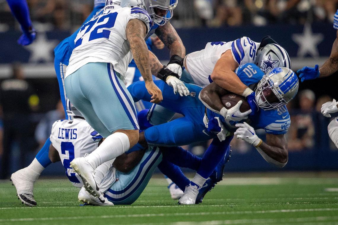 Dallas Cowboys linebacker Leighton Vander Esch tackles Detroit Lions running back Jamaal Williams at the AT&T Stadium in Arlington on Sunday, Oct. 23, 2022.