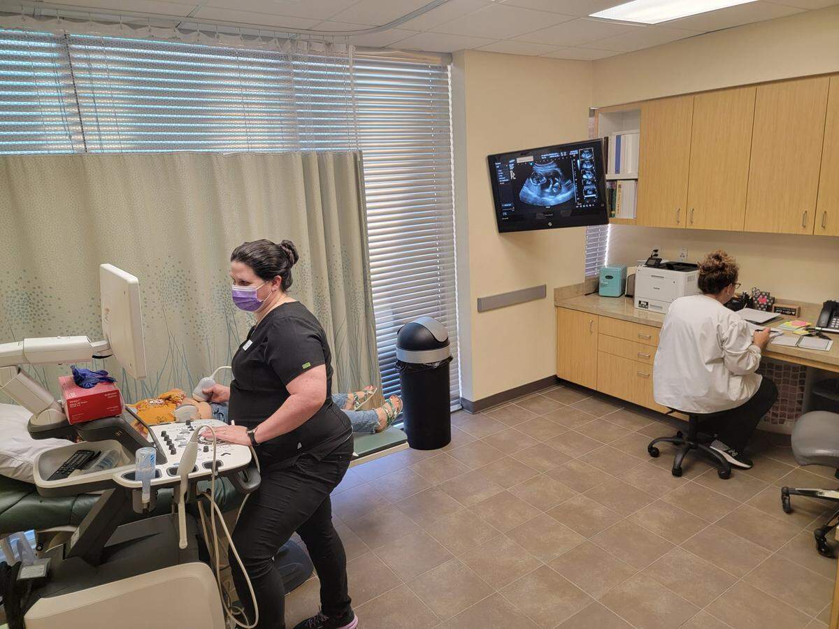 A staffer at the Fort Worth Pregnancy Center performs a sonogram on a client. Once a test confirms pregnancy, each woman visiting the clinic receives a sonogram.