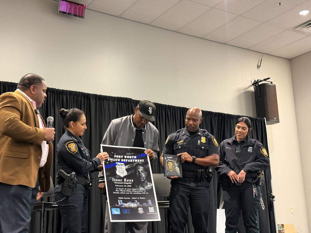 Fort Worth police presented a poster to Isaac Keys as a gift during Tuesday’s event.