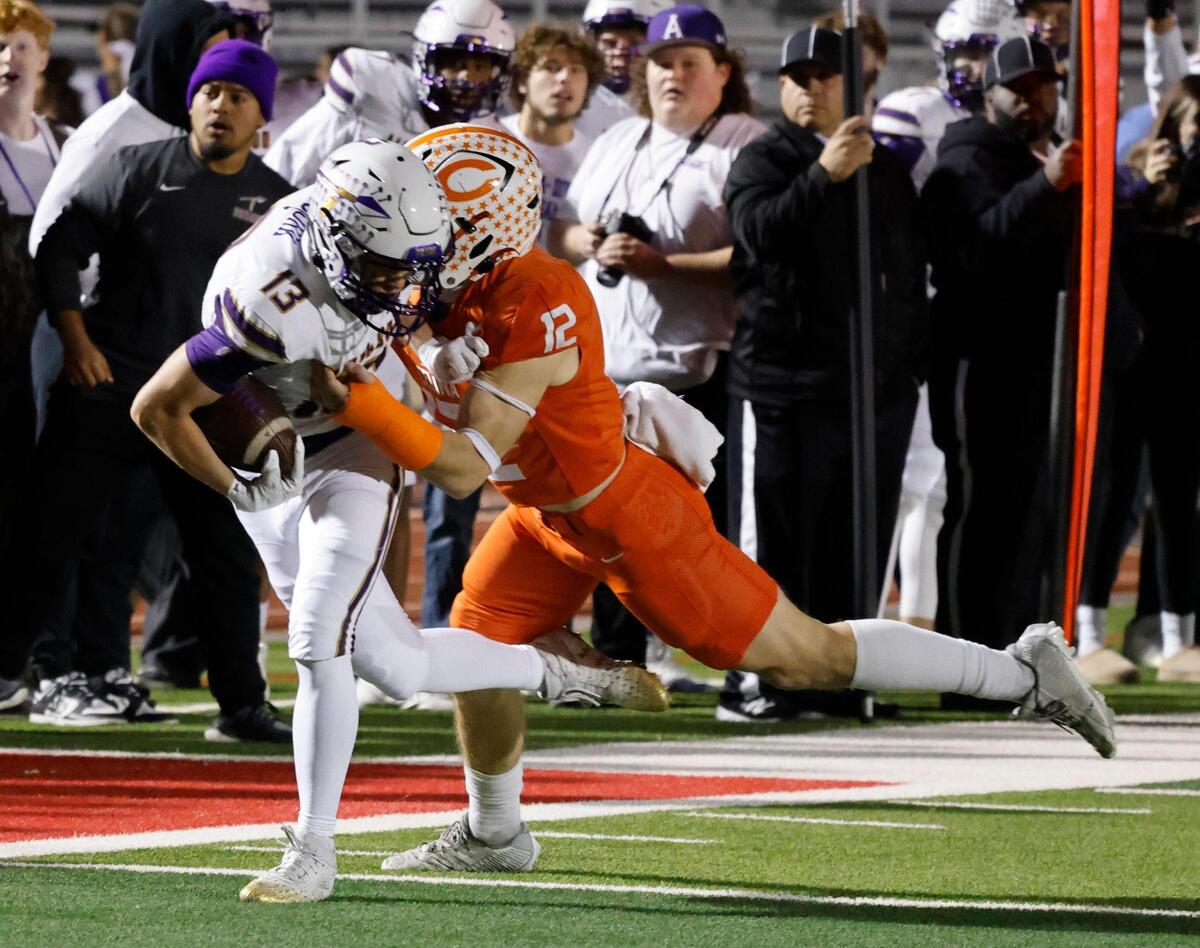 Celina defensive end Colten Place (12) brings down Alvarado wide receiver Logan Bjork (13) along the Indian sidelines during the UIL 4A D1 Quarterfinals at Mustang-Panther Stadium in Grapevine, Texas, Friday, Dec. 06, 2024.