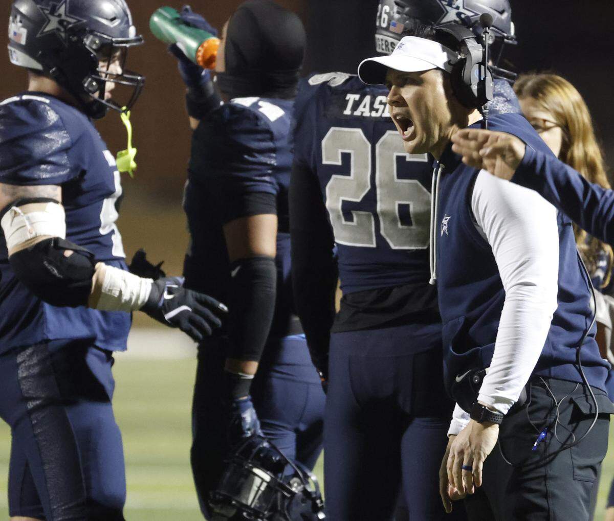 Frisco Lone Star head coach Jeff Rayburn shouts words of encouragement during a timeout against Aledo during the first half of a Class 5A Division I state semifinal Friday at Newsom Stadium in Mansfield.
