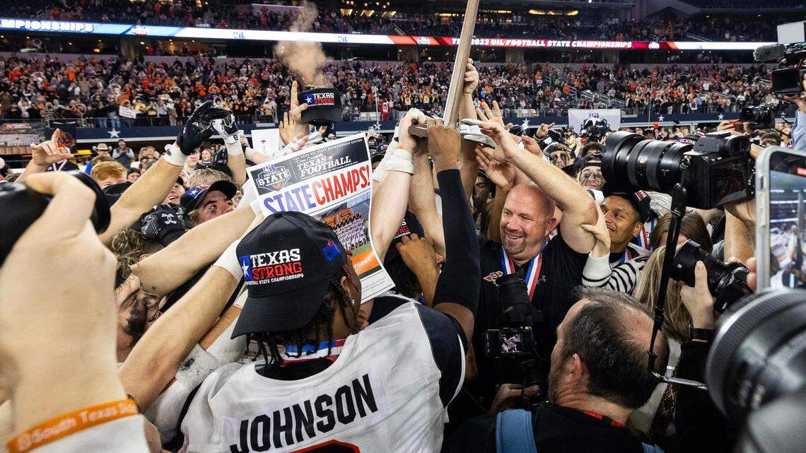 The Aledo Bearcats celebrate after winning the 5A Division I football state championship game against the Smithson Valley Rangers at AT&T Stadium in Arlington on Friday. Aledo won 51-8 to capture the programs 12th state title.