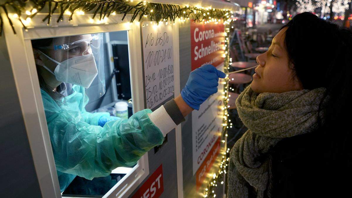 Expanded coronavirus testing, such as seen recently in Berlin, Germany, will be key to avoiding the worst of the omicron variant. (AP Photo/Michael Sohn)