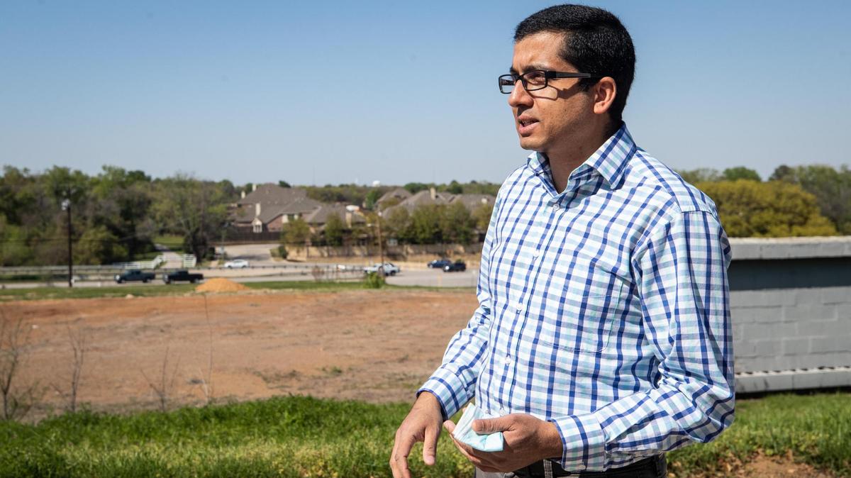 Rabi Adhikari, volunteer architectural designer, looks over the vacant land where the new Nepali Cultural and Spiritual Center is slated for construction in Euless.