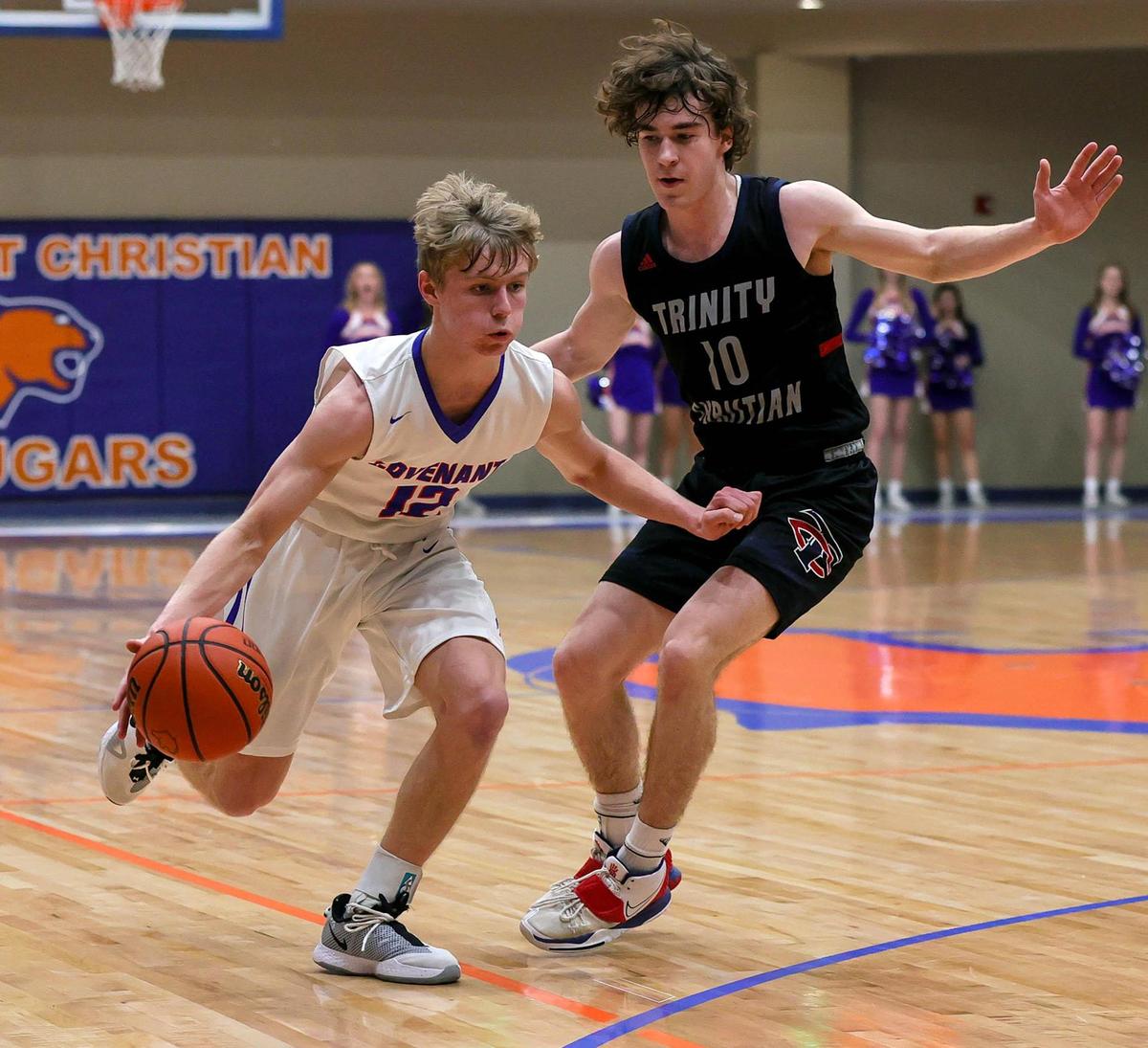 Colleyville Convenant guard Caleb Turner (12) tries to get around Lubbock Trinity guard Ethan Duncan (10) during the first half of a High School Basketball game played at Colleyville Convenant High School, January 29, 2021. (Steve Nurenberg Special to the Star-Telegram)