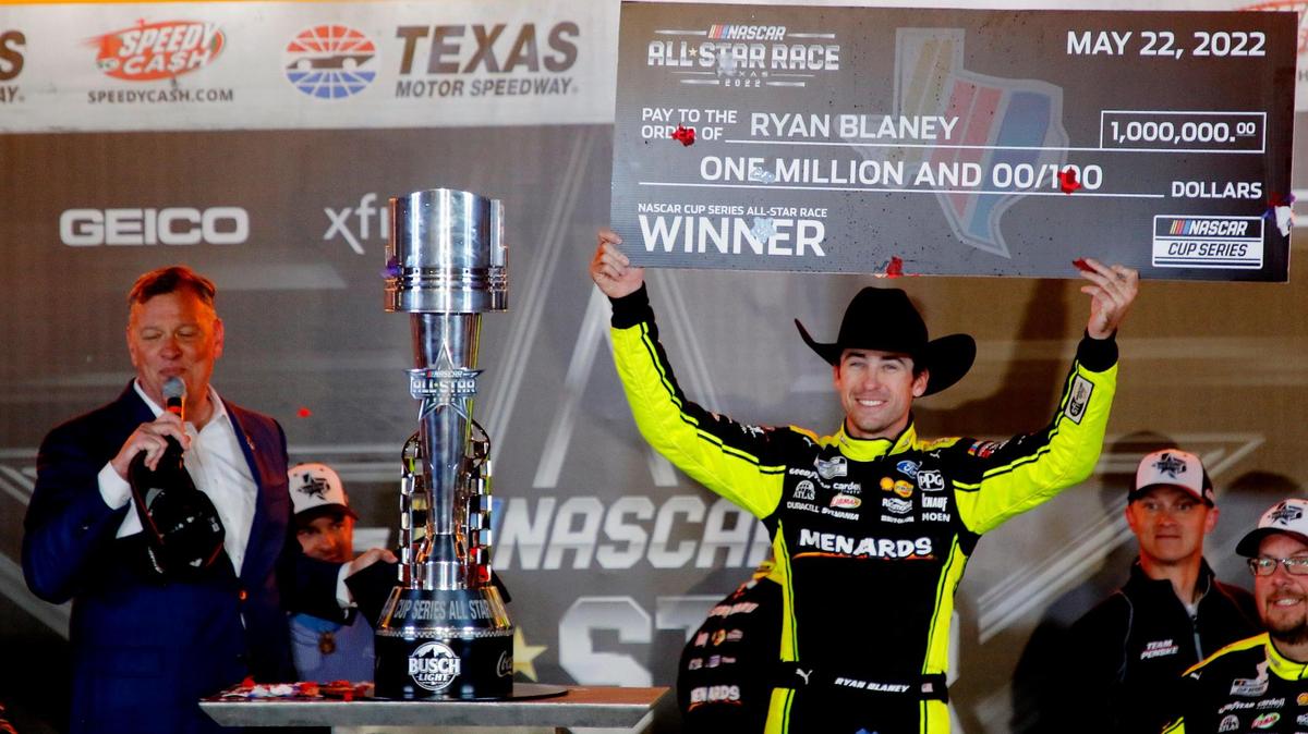 Ryan Blaney holds up his winning check after the NASCAR All-Star Race at Texas Motor Speedway Sunday night in Fort Worth