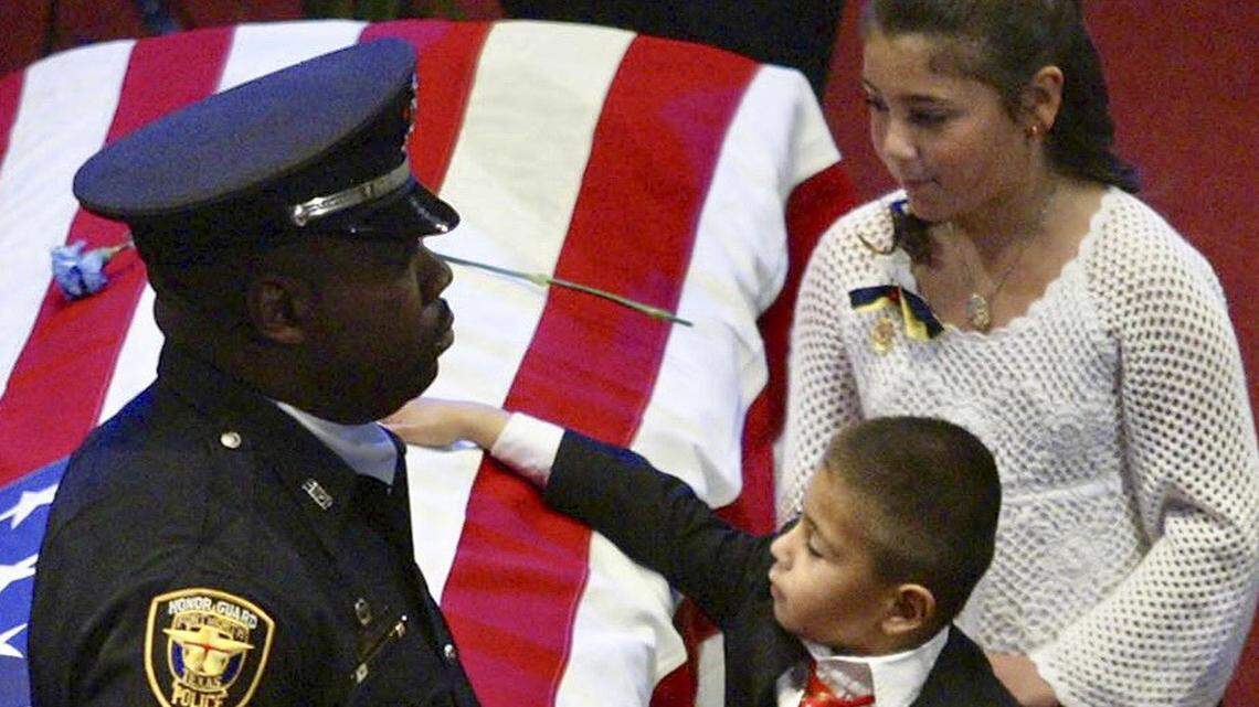 In 2005, Justin Nava (now Henry) and KayLeigh at the funeral for their father, Officer Henry (Hank) Nava.