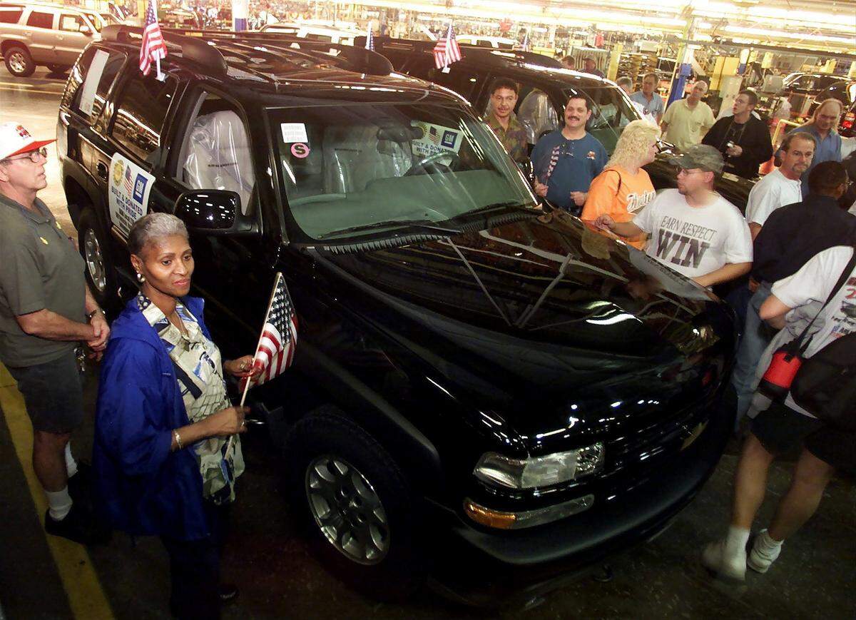Dec. 4, 2001: Two new Chevy Tahoes were driven off the assembly line at the General Motors Arlington Assembly plant to be donated to the New York Fire Department, three months after the 9/11 attacks. Tessie Redd, left, an assembly line worker, attended the ceremony with other GM employees.