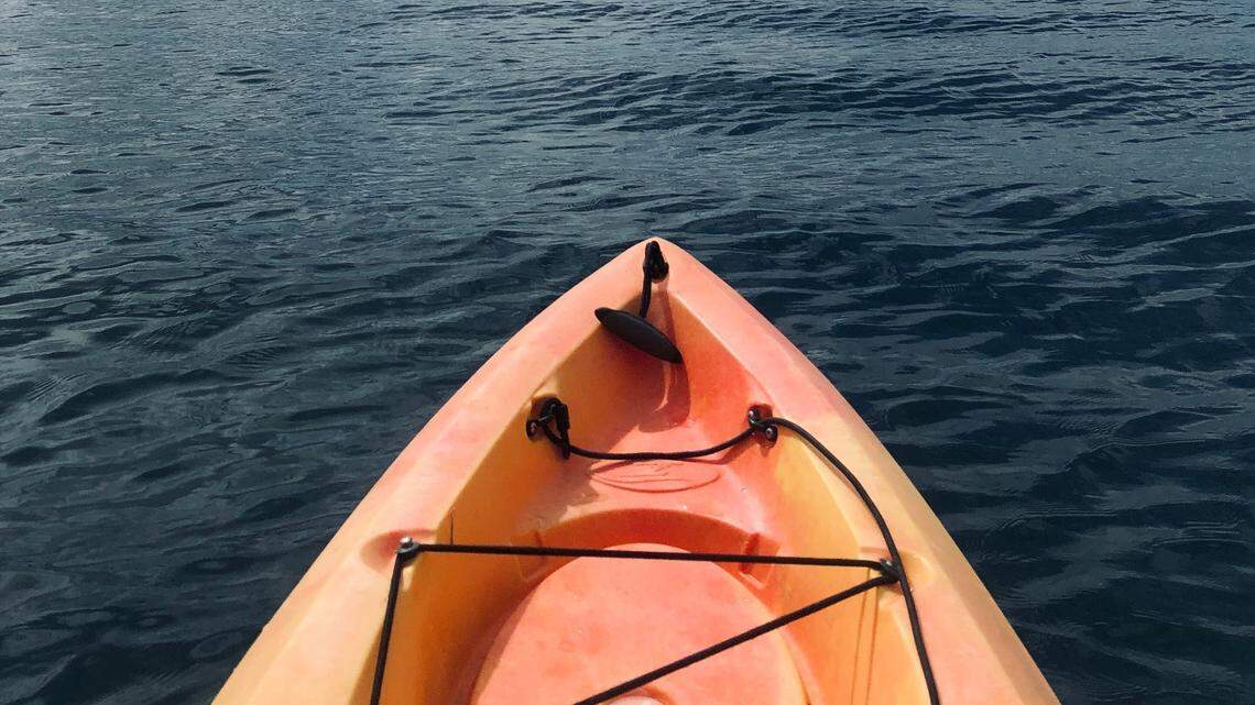 A woman was found dead days after kayakers spotted her empty boat, authorities said.
