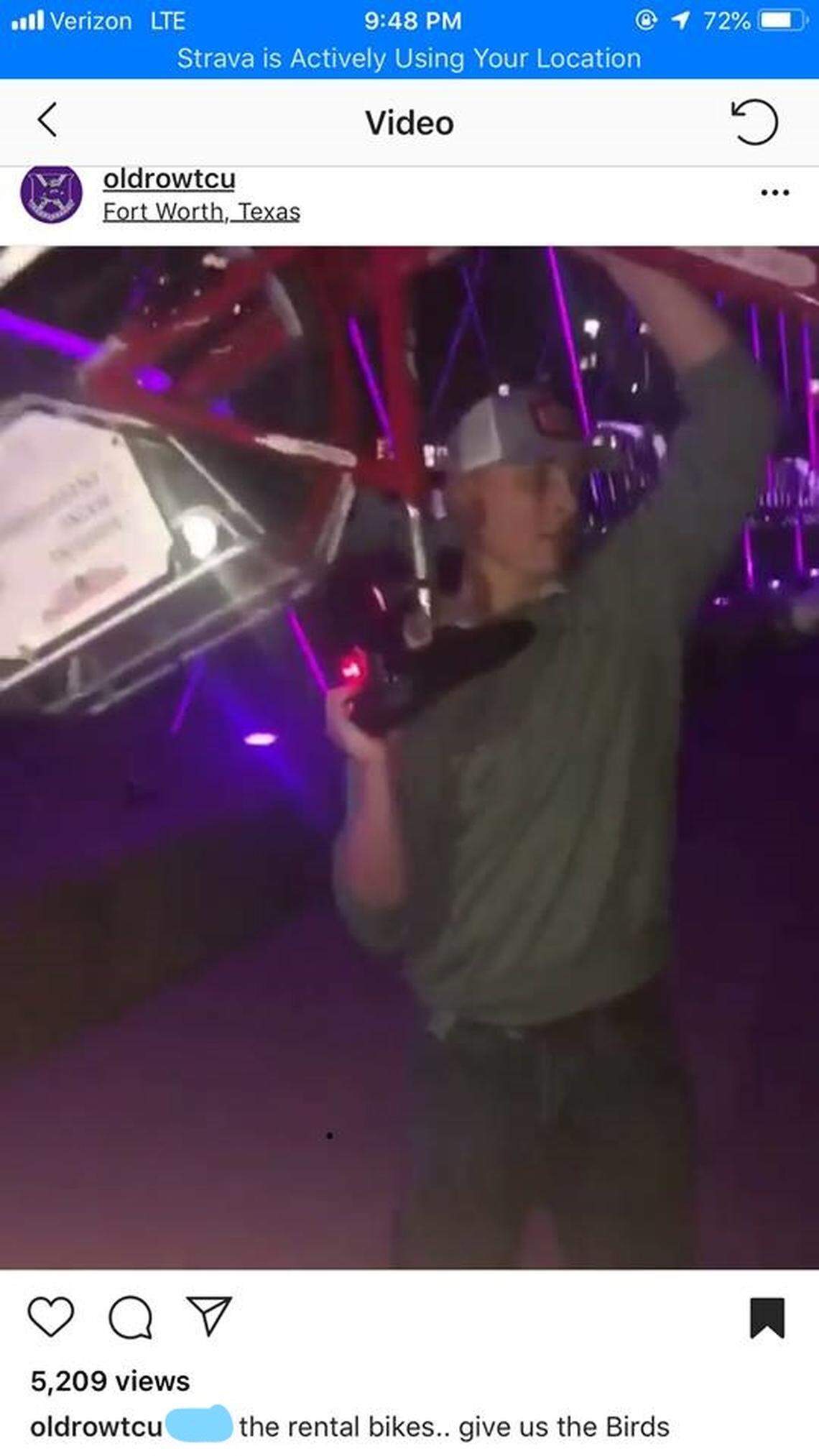 A screen shot of a man from a video showing him tossing a Fort Worth B-cycle into the Trinity River from the W. Seventh Street bridge.