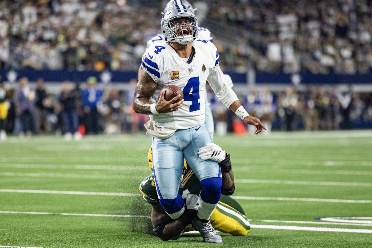 Packers defensive end Micah Parsons chases down and tackles Cowboys quarterback Dak Prescott for a sack in overtime Sunday.