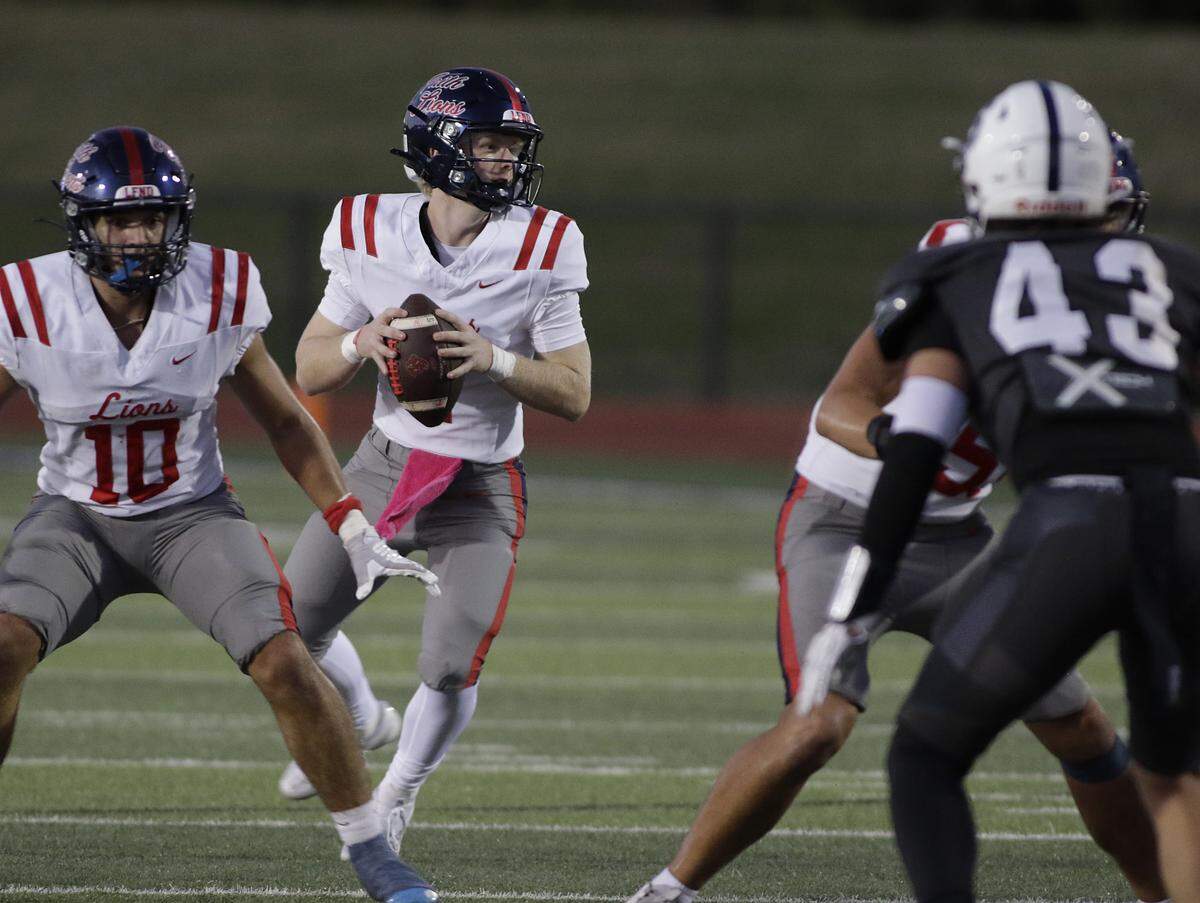 Grapevine Faith’s Austin Cosby looks for a receiver against All Saints during their game at All Saints Episcopal on Friday, Oct. 10, 2025.