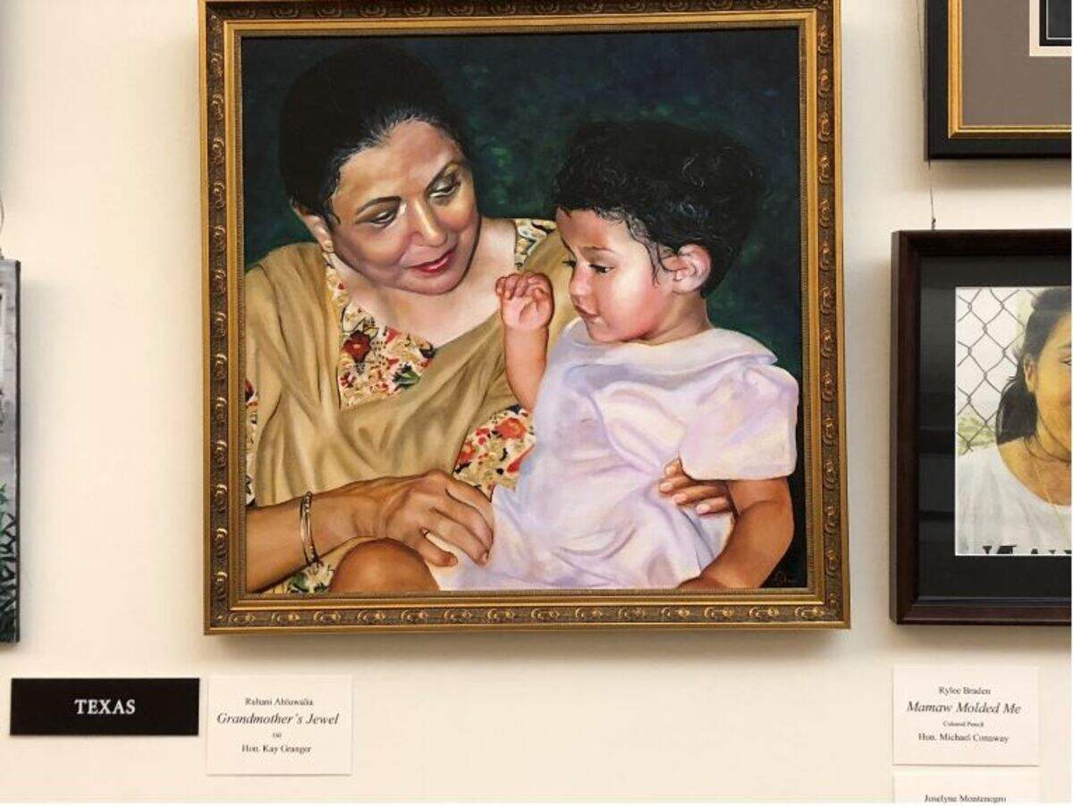An award-winning painting of a young Ruhani sitting on her grandmother’s lap, named Grandmother’s Jewel, hangs in the United States Capitol.