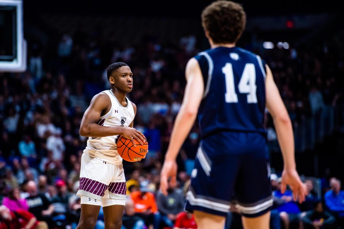 Daniel Viera-Tuck (1) holds the ball outside of the three point line during the 5A state semifinal game between Mansfield Timberview and Boerne Champion in San Antonio, at the Alamodome, on March 10, 2022. Timberview went on to win 55-43.