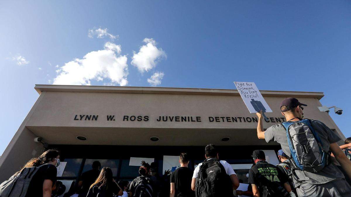 In this June 2020 file photo, a group protests at the Tarrant County Juvenile Detention Center in Fort Worth over the detainment of multiple youth accused of involvement in a park shooting.