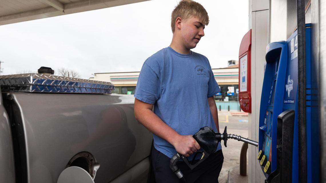 Ian Bothwell pumps fuel on Monday, March 14, 2022, in Fort Worth.