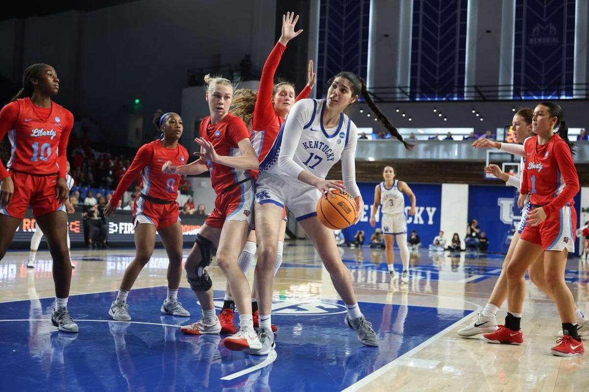 LEXINGTON, KENTUCKY - MARCH 21: Clara Silva #17 of the Kentucky Wildcats battles to get a shot off against Pien Steenbergen #7 of the Liberty Lady Flames during the second half in the first round of the NCAA Women's Basketball Tournament on March 21, 2025 in Lexington, Kentucky. (Photo by Andy Lyons/Getty Images)