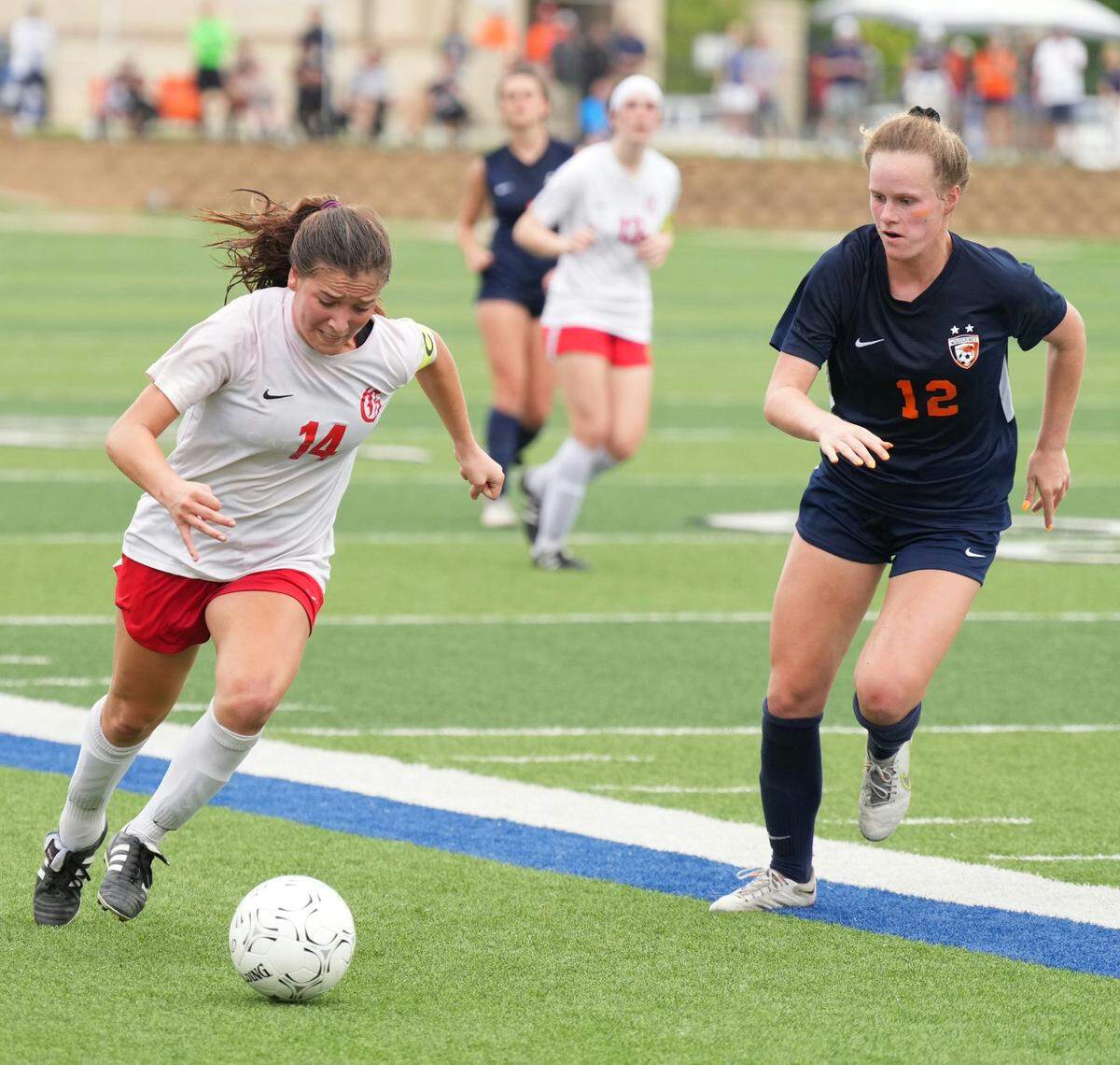 Grapevine’s Theresa McCullough dribbles past a Frisco Wakeland defender during the 5A title game April 16, 2022 (Ken Murphy/MaxPreps)